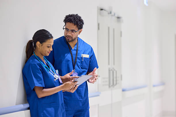 istock Nurse discussing with female colleague 2206823745