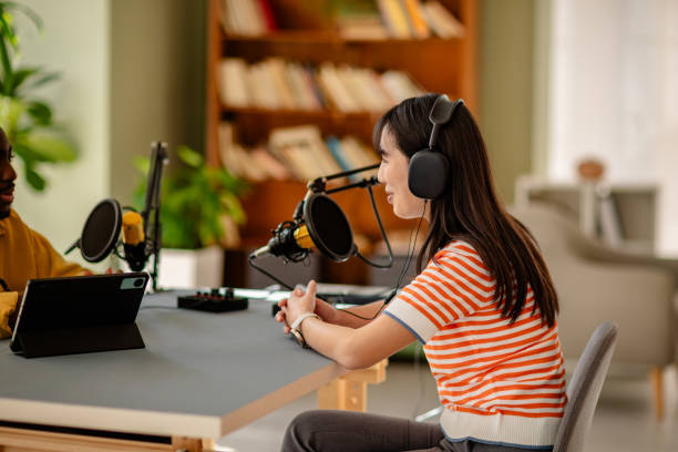 istock Engaging discussion between podcast host and guest in a modern studio environment 2206823971
