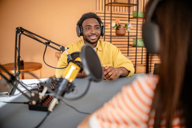 istock Engaging discussion between professionals in a radio studio during a live podcast recording 2206824248