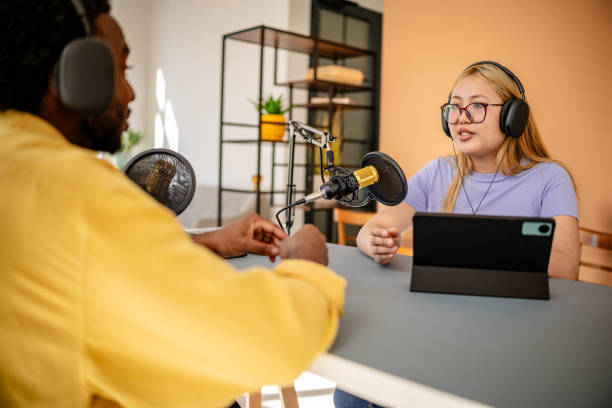 istock Engaging podcast discussion between professionals in a modern studio setting focusing on journalism and media 2206827703