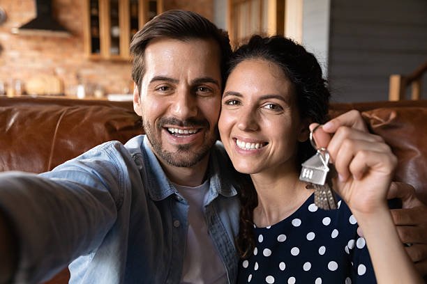 istock Head shot happy young couple showing keys, excited by relocation 2206828788