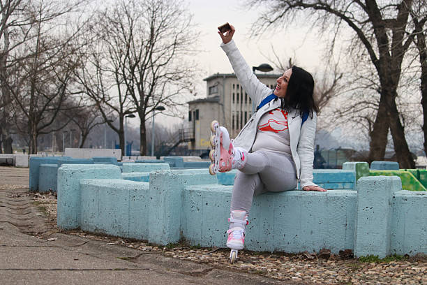 istock Active mature woman relaxing after rollerblading 2206830480
