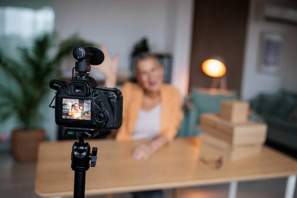istock Excited Vlogger Films Unboxing in Cozy Home Studio 2206830538