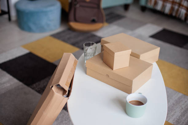 istock Variety of Unpacked Boxes on Coffee Table 2206833213