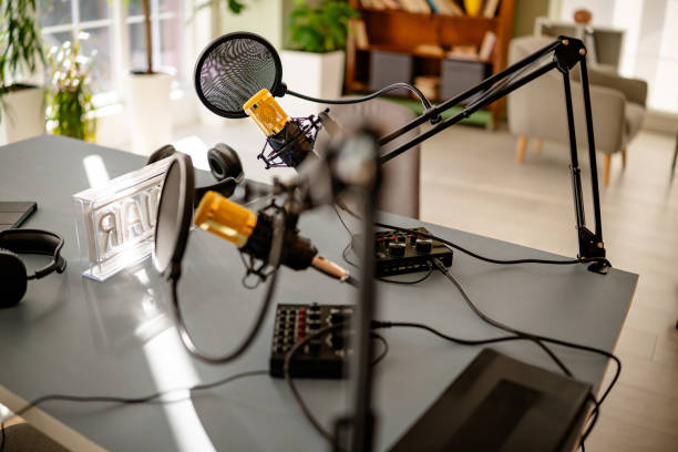 istock Podcast studio setup featuring professional equipment and a vibrant, collaborative atmosphere among young adults 2206834713