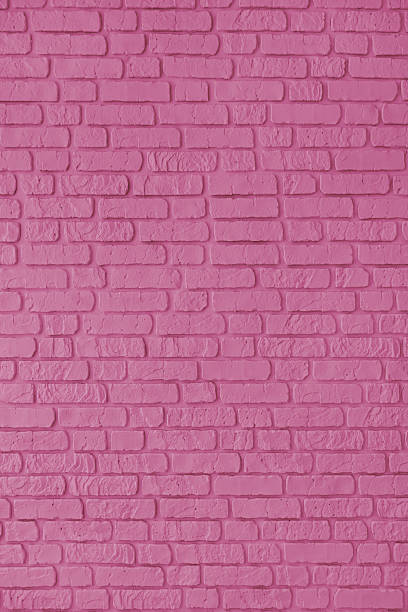 istock Pink color painted brick wall texture, brickwork, masonry of stone blocks vertical background 2206838589