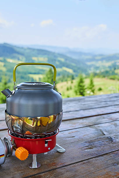 istock Enjoying a kettle on a camping stove with a scenic mountain view in daylight 2206839136