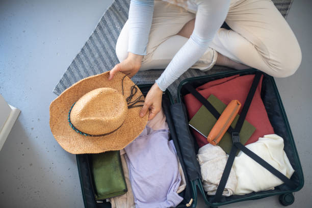 istock Young woman packing at home 2206839526