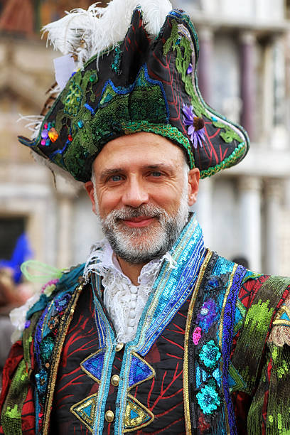 1st of March. Venice. Italy.\n\nHandsome man in costume at the St Marks Square.\nDuring the annual celebration of Venice Carnival. The town is full of unrecognizable people in their amazing costumes - just waiting to be seen and photographed. An event that attracts curious, locals, tourists and photographers from all over the world. Not too mention the performers who also come from everywhere in the world.