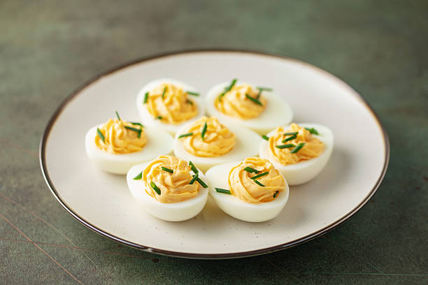 istock Egg flight  -Stuffed eggs with  yolk, mayonnaise an scallion. 2206840932