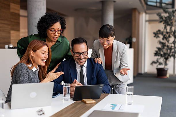 istock Team Collaborating Around a Laptop During Office Discussion 2206841002
