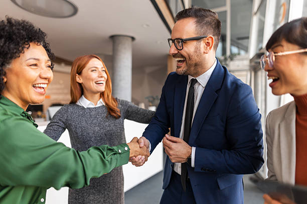 istock Diverse Team Celebrating Success and Teamwork in a Modern Office 2206841196