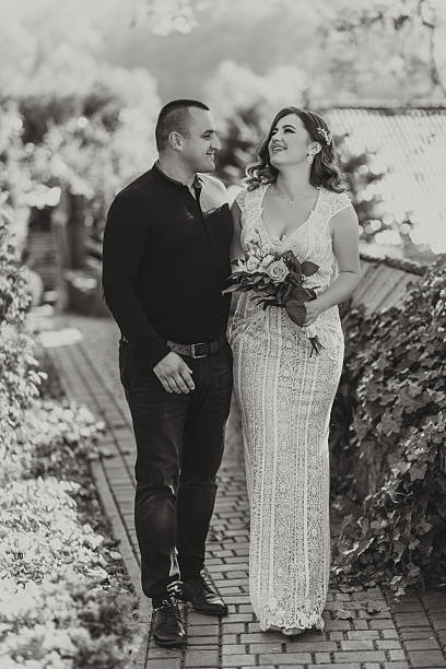 istock A man and woman are walking down a brick path 2206841226