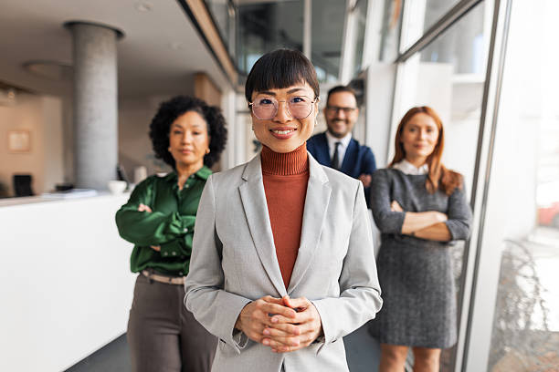 istock Diverse Team of Professionals Standing Confidently in Modern Office Environment 2206841252