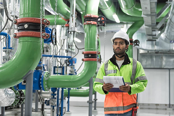 istock people work in chiller plant room 2206847810