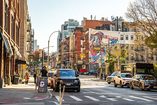 New York City, United States of America - September 22, 2018: Low-angle view of a laundromat sign in Chinatown, New York City, showcasing bilingual signage in English and Chinese characters, adding a vibrant touch to the neighborhood's character