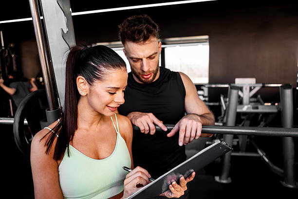 istock Trainer Supervising Heavy Deadlift Preparation 2206851937
