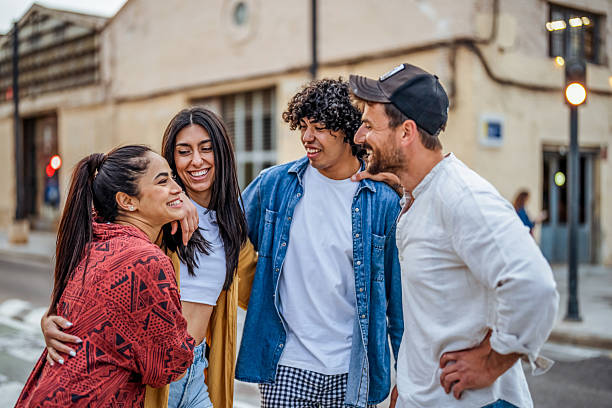 istock Group of Friends Laughing and Bonding Outdoors in a Joyful Urban Setting 2206853855