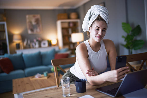 istock Female business person using digital tablet and laptop e-learning or remote working at home office, looking at digital tablet watching webinar, learning training, studying online seminar or video calling. 2206858215