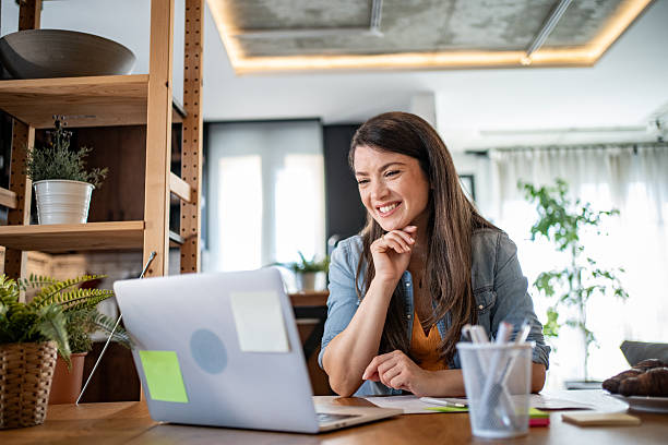 istock Young woman working from home having a video call on laptop 2206858229