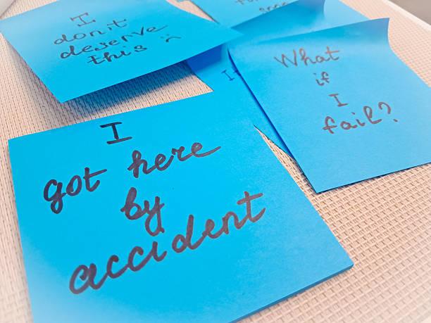 istock Imposter syndrome concept depicted with sticky notes of self-doubt and confusion. 2206859786