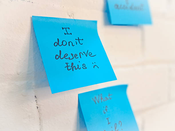istock Imposter syndrome concept depicted with sticky notes of self-doubt and confusion. 2206859796