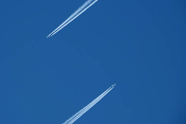 Two contrails. Airplane trail in the clear blue sky