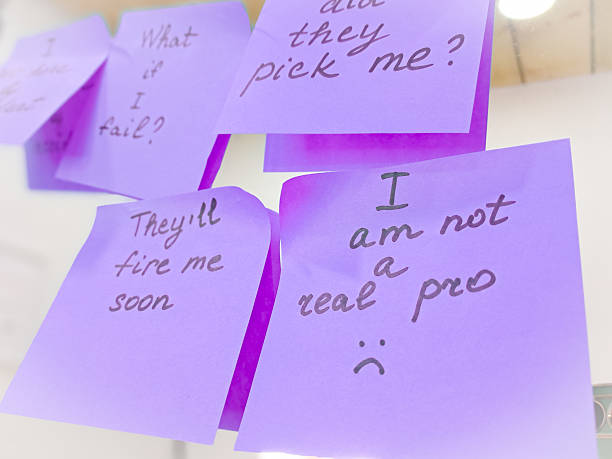 istock Imposter syndrome concept depicted with sticky notes of self-doubt and confusion. 2206859824