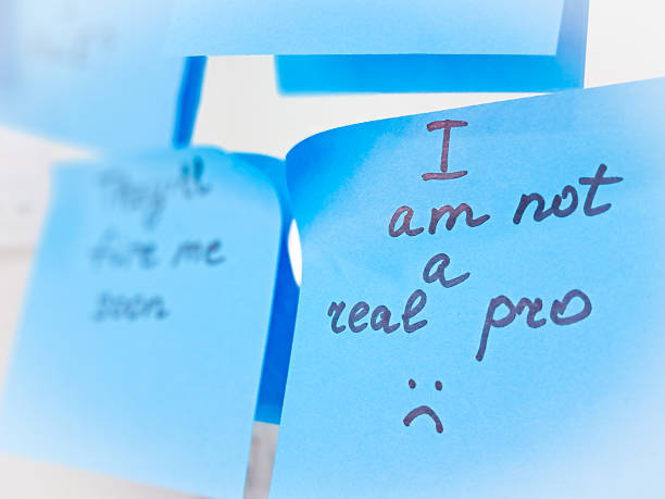 istock Imposter syndrome concept depicted with sticky notes of self-doubt and confusion. 2206859825