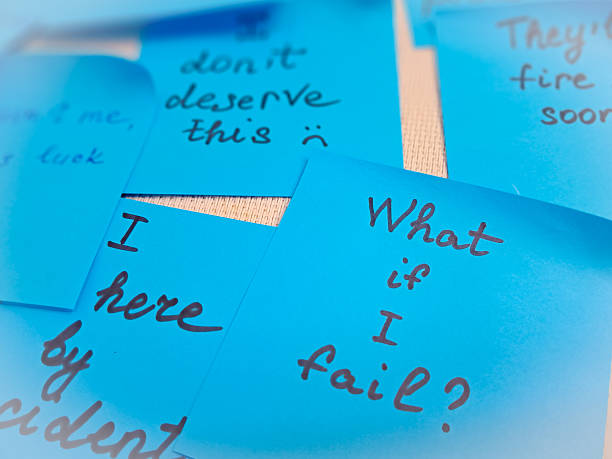 Imposter syndrome concept depicted with sticky notes of self-doubt and confusion.