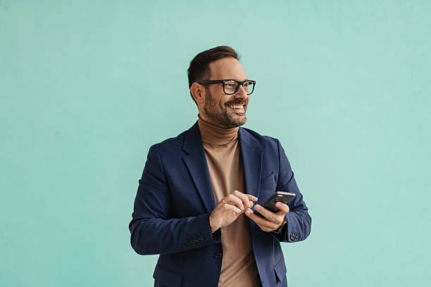 istock Man focusing on smartphone with a playful expression 2206861308