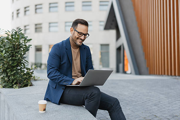 istock Professional Man Working on Laptop in Urban Setting 2206861952