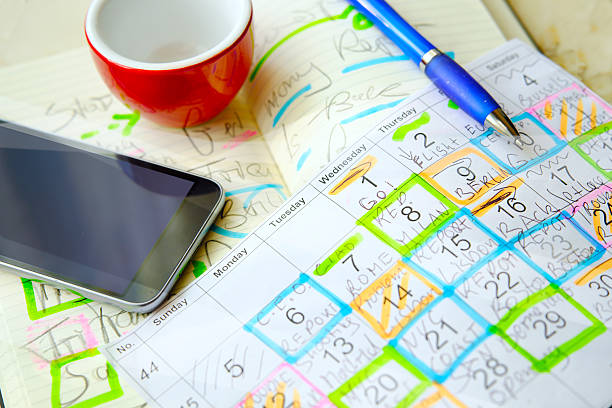 istock Calendars with business appointments and adhesive notes on cluttered desk. Business concept 2206862047