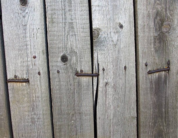 Old weathered wooden planks with rusty nails background