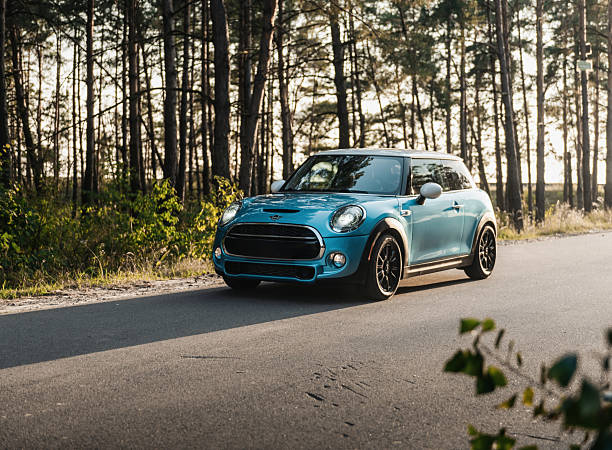 Bad Homburg, Germany - April 14, 2025: A Mini Cooper (F56) on German highway A5 nearby Frankfurt, Germany. The Mini range was introduced in July 2001, following the acquisition of the Mini brand by German automaker BMW