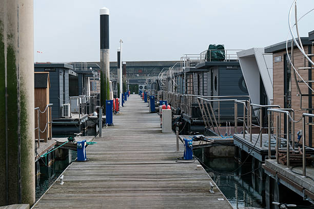 Tiny homes, house boats and Boats and Yachts moored in Brighton Marina on the south coast of England 23 March 2025 - Brighton, UK - Tiny homes, house boats and Boats and Yachts moored in Brighton Marina on the south coast of England small houseboats stock pictures, royalty-free photos & images