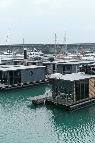 Tiny homes, house boats and Boats and Yachts moored in Brighton Marina on the south coast of England 23 March 2025 - Brighton, UK - Tiny homes, house boats and Boats and Yachts moored in Brighton Marina on the south coast of England small houseboats stock pictures, royalty-free photos & images