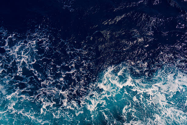 istock Aerial View of Dark Ocean Waves with White Seafoam 2206868073