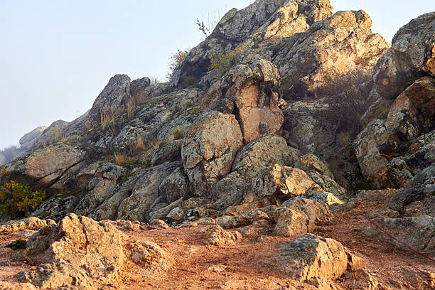 Granite boulders in the rays of the setting sun