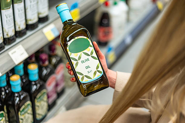 istock Woman buying olive oil 2206870267
