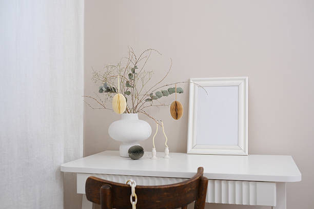 istock A beautiful and serene minimalist workspace that features a lovely vase, dry branches, and a blank frame for creativity. 2206870608