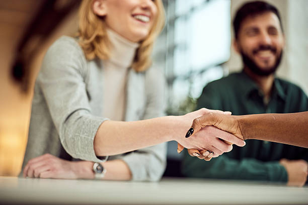 istock Handshake Between Professionals Showing Agreement and Friendly Collaboration in Bright Modern Office 2206871068