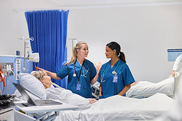 istock Female nurse talking about oxygen level with coworker 2206871318