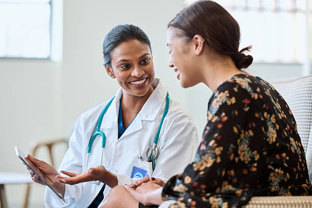 istock Doctor showing positive test results to patient 2206871739