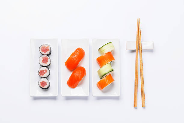 Assorted sushi and maki rolls beautifully arranged on plates