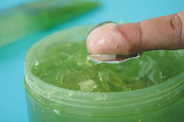 istock Fresh aloe vera sliced and liquid gel in plastic container on white background 2206874183