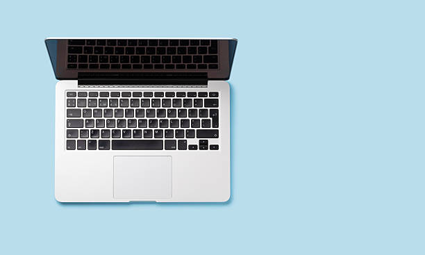 istock A laptop placed against a blue background in a flat lay style 2206874330