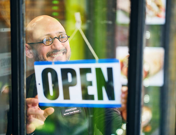 istock Store Owner Opening for the Day 2206875530