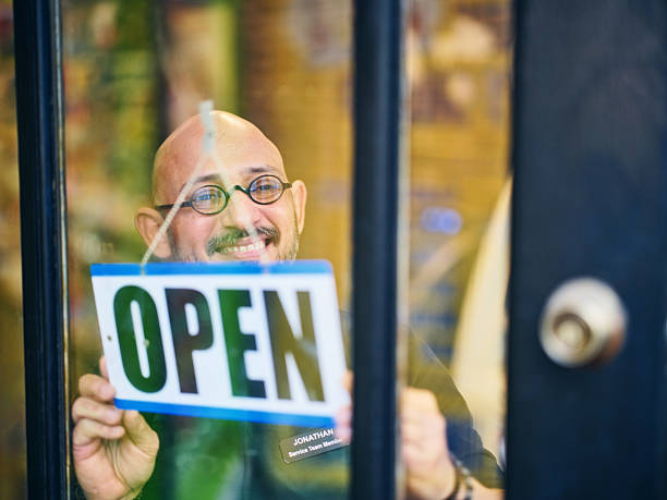 istock Store Owner Opening for the Day 2206875538