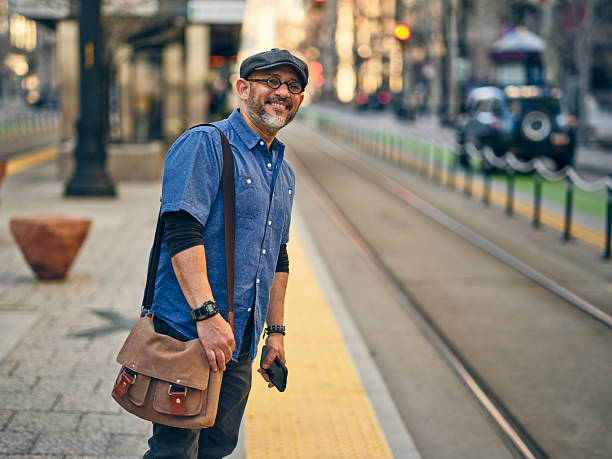 istock Man on a Lightrail Train Platform in a City 2206875959